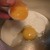Pour the yolk gently into the other half of the shell to drain the remaining egg white before adding it to the mixture. Pour the yolk gently into the other half of the shell to drain the remaining egg white before adding it to the mixture.