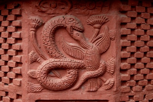 A snake devouring a bird : Decorations on pillar : Nandadulal Jiu temple, Gurap