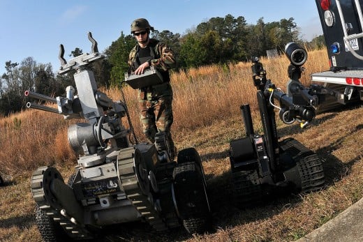 A soldier using a military robot.
