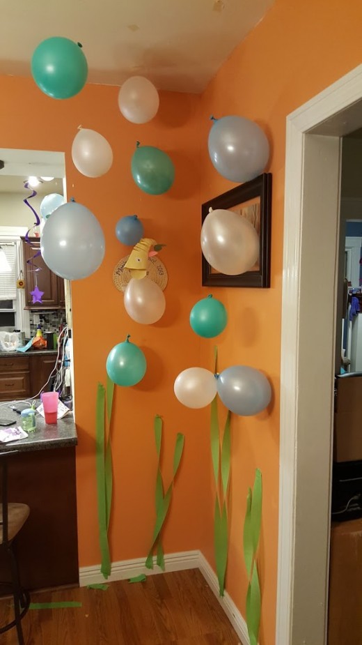balloon bubbles hung from ceiling to save cost on helium.
