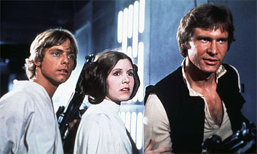 Princess Leia flanked by Luke Skywalker and Hans Solo