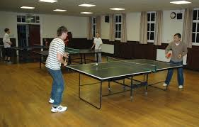 People playing table tennis