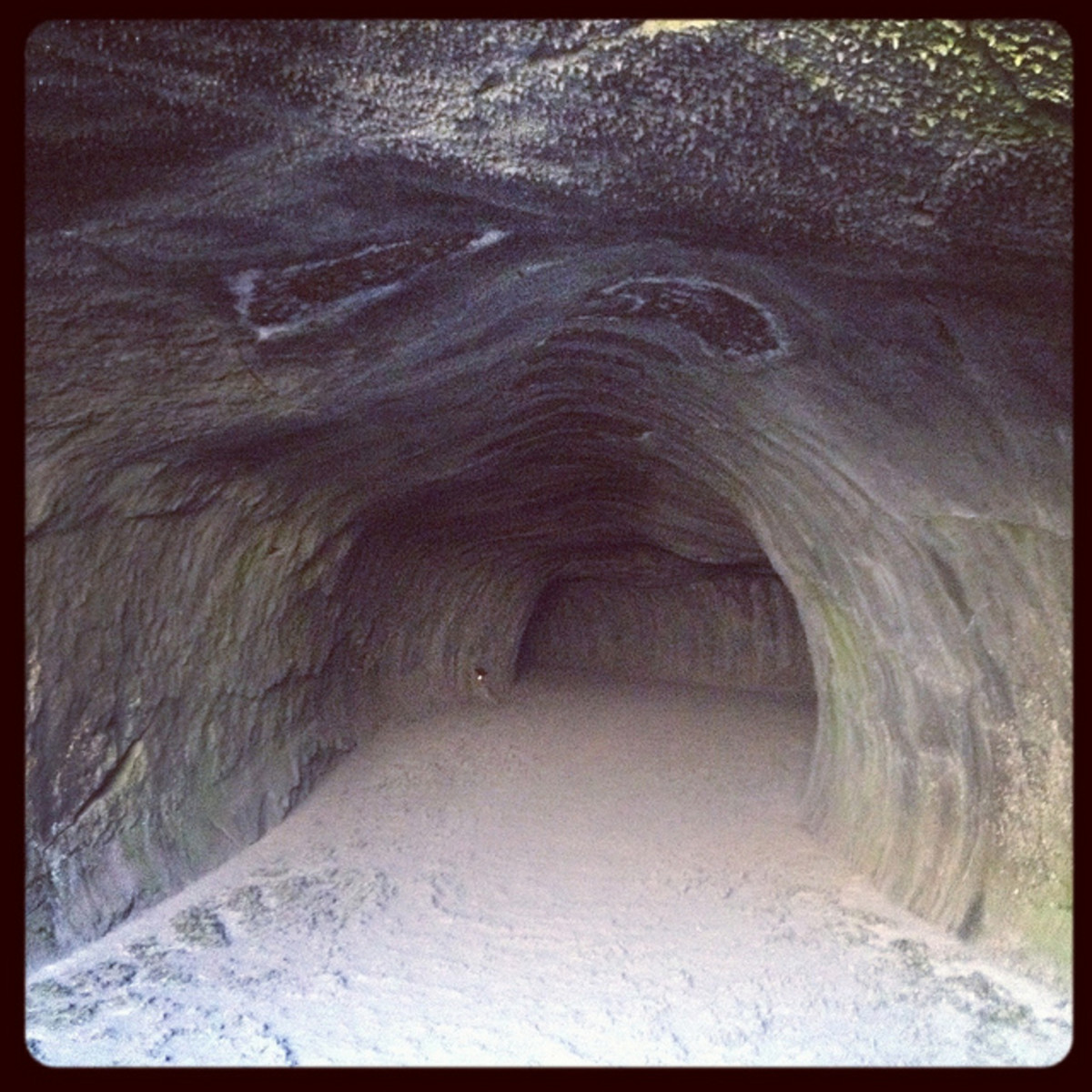 As you enter the cave, light pours in, but as you venture further in, and go around this corner, all light disappears