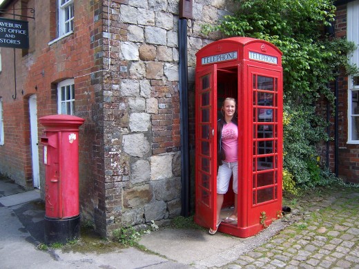 My daughter in a phonebox in Avebury England