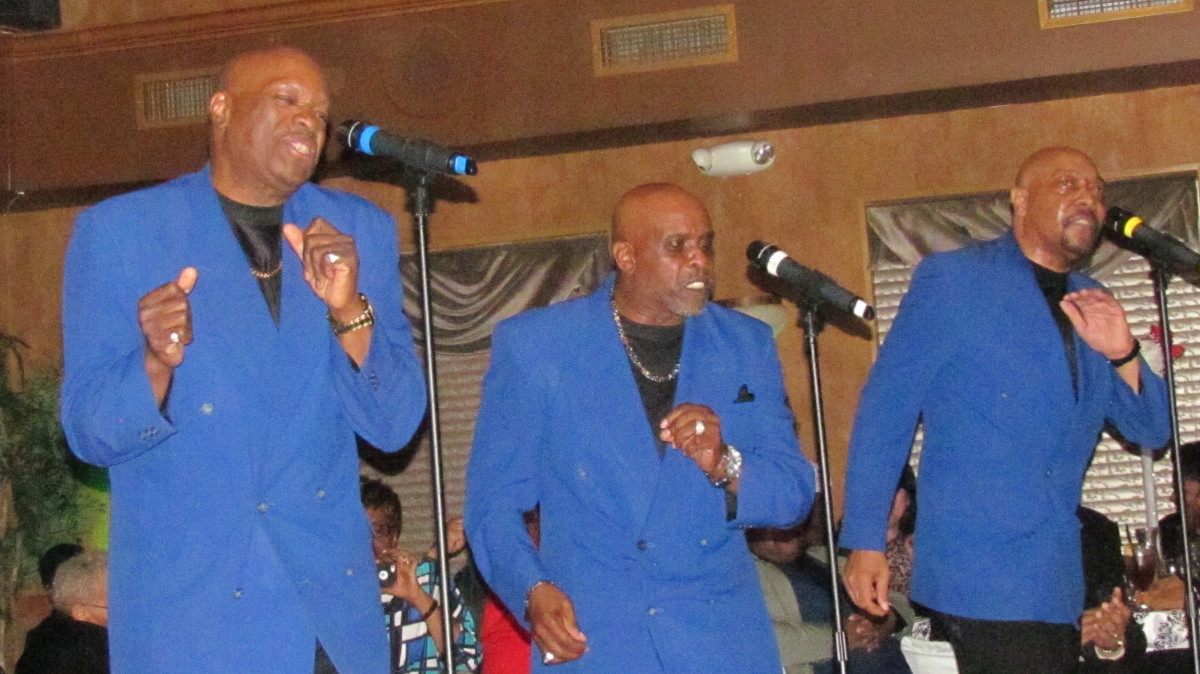 The Legendary Blue Notes perform steps in unison to their major hits.