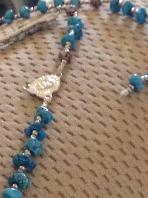 A sudden, unthinking Tug turns a Rosary into a string of beads.