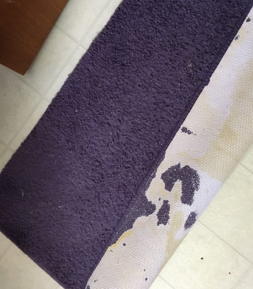Bath mat with damaged rubber backing 