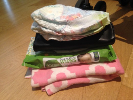 My wallet, a blanket, a couple of diapers, wipes and extra clothes easily fit.