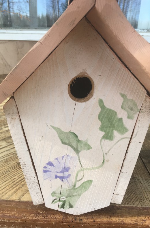 Front view of birdhouse with stencil painting