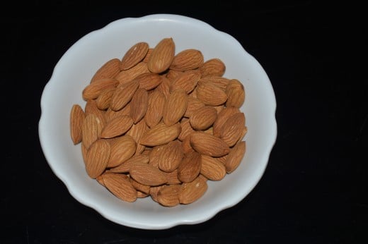 Step one: Soak almonds in hot water for removing the husk.