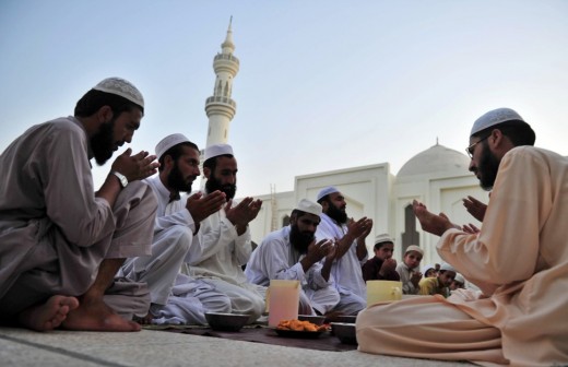 Muslims in worship in Saudi Arabia with Duas to Allah. 