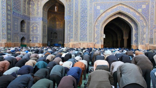 Muslims worshiping through prayer to Allah. 