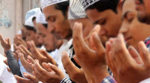 Hands in worship to Allah in India. 