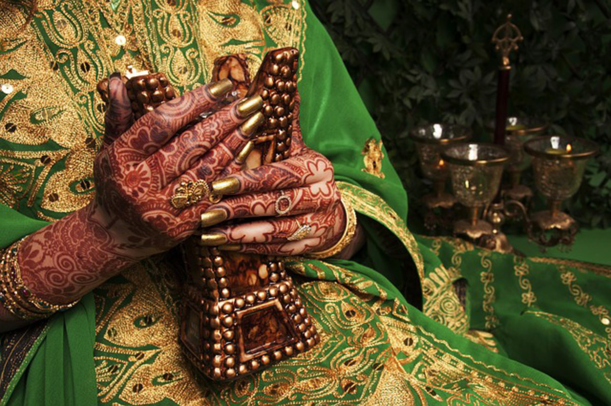 Hands of a Mehndi henna design worn by a bride. These tattoos are done with Henna.
