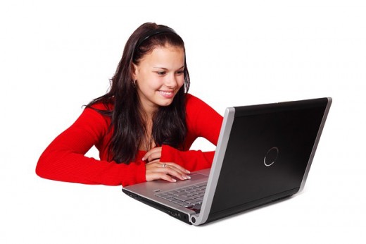 A young woman working at her computer. 