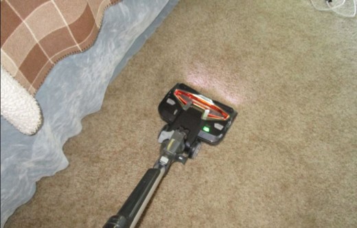 Vacuuming - Requires push and pull movement with hand, requires posturing of back, and requires a step to and back with feet