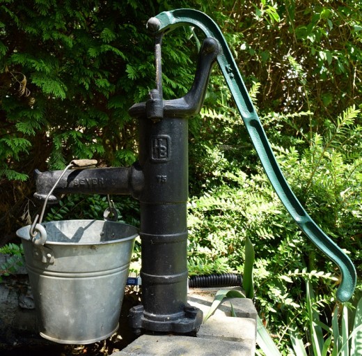 Garden pump and water bucket.