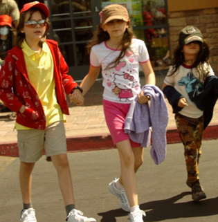 The three children; Prince, Paris and Blanket.  The only one that truly could be genetically linked to Michael according to looks would be Blanket; however, his look and the present day Michael match; not the true Michael Jackson.
