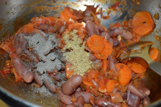 Step four: Add coriander powder, sugar, and pepper powder.  Mix well and stir-cook until it blends with the contents.