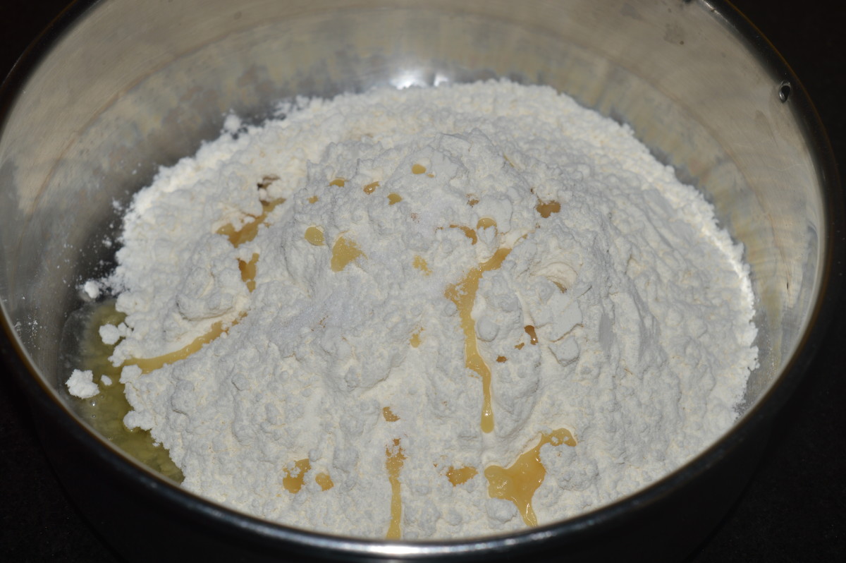 Step one: In a mixing bowl, add all purpose flour, oil, and salt.