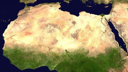A satellite view of the continent showing the Sahara and green vegetation. 