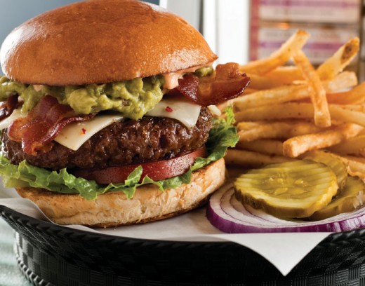 A large burger is a common cheat meal choice.