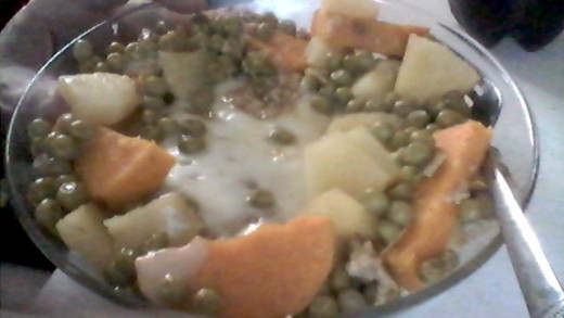 My favorite meal.  Ground Turkey patty with Egg and Garlic mixed in, Sweet Potatoes and Pineapple slathered with Honey, Peas and Swiss Cheese on top.