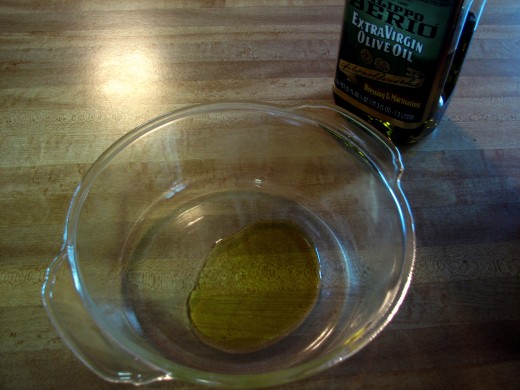 Add about 3T of olive oil to the dish and coat the sides of the dish with this oil real good.