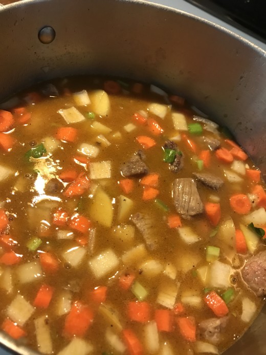 Add enough liquid to cover the meat and vegetables. Bring to a boil, reduce to a simmer, and simmer about an hour.