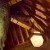 Looking up at the ceiling beams and handcrafted lighting fixtures Looking up at the ceiling beams and handcrafted lighting fixtures
