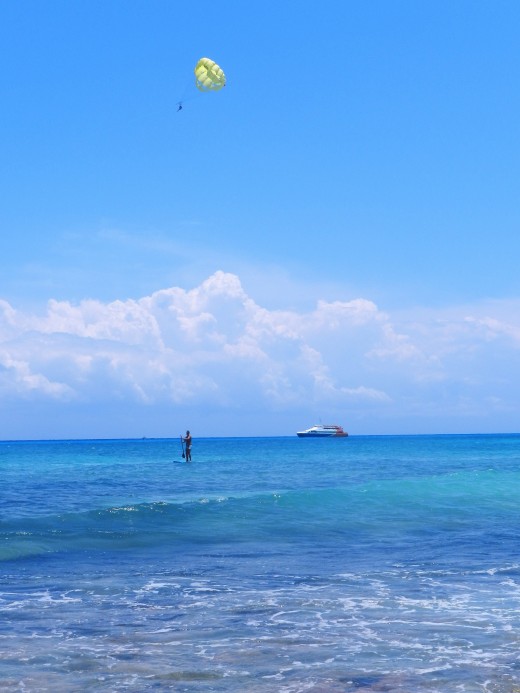 Take a boat ferry to Isla de Cozumel, wind sail, or paddle board 