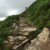 The track is steep in places with rocks forming steps.