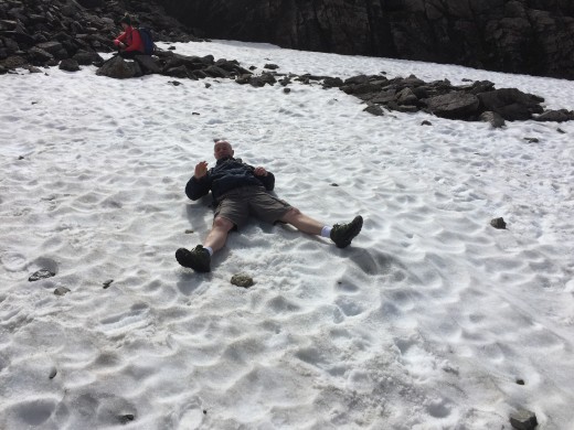 Rob's inner child gets the better of him and he can't resist temptation to snow angel. I bet it's still freezing cold on those bare legs.