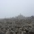 The summit trig point within view. It's a shame there is cloud cover and the vistas are obscured but at least we can see where we are putting our feet. It is quite cold here now and we have all put on top layers.