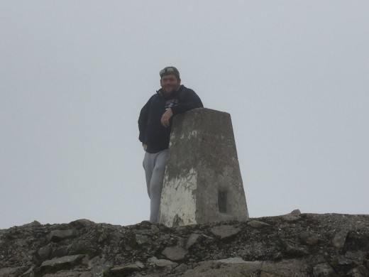 Another photo of Steve at the summit trig point.