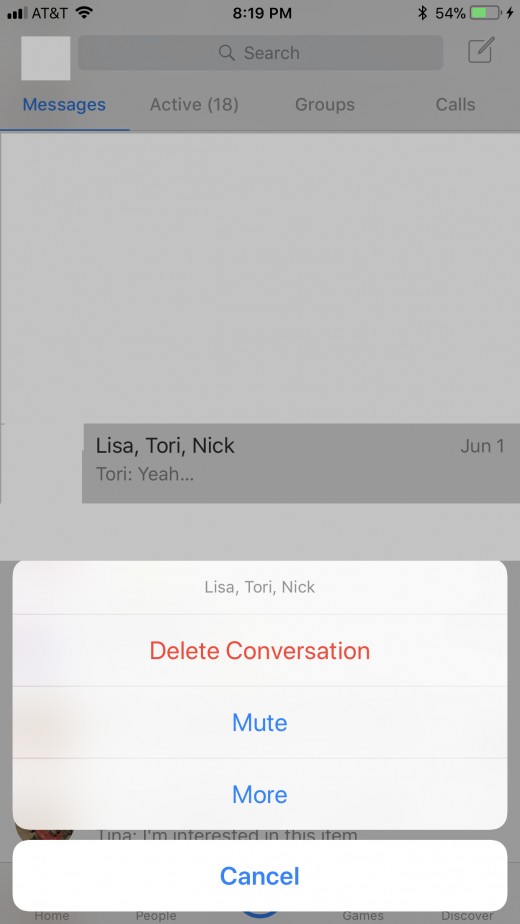 Navigate to the group conversation you want to remove yourself from. Hold your finger against that conversation until a context menu flies up from the bottom of the screen.