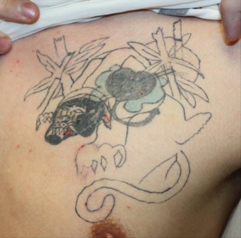 Perfect example of what I call a "basement" tattoo. lol I enjoy this very much! 