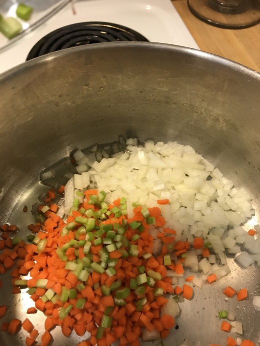 Onions, carrots and celery - a classic mirepoix - form the base for the soup itself. They work beautifully together for that perfect, comfort food flavor.
