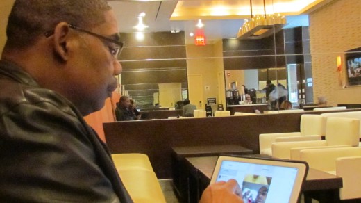 Walker, checks his emails in the hotel restaurant before breakfast. Later that afternoon we went to the Apollo Theater for Amateur Night with Steve Harvey as host.