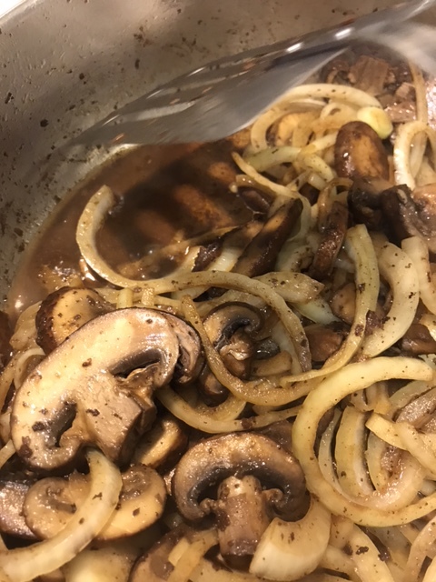 The mushrooms will release their moisture at first, which helps release the fond from the bottom of the pan. After a few minutes, they will reabsorb some of it, adding the flavor from the cooked Salisbury Steaks to the gravy. Beautiful!