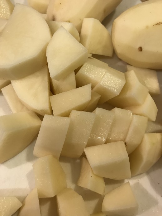 Cut the potatoes into small cubes. They'll cook much faster and more evenly. Using approximately 1 inch cubes will reduce the cooking time to about 15 minutes.