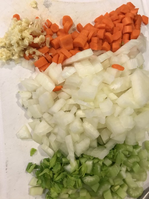 Dice onion, celery, carrot and garlic for the base of this simple homemade soup. The veggies saute for just a few minutes, making this soup pretty quick!