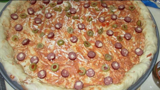 place olive slices in between pepperoni slices
