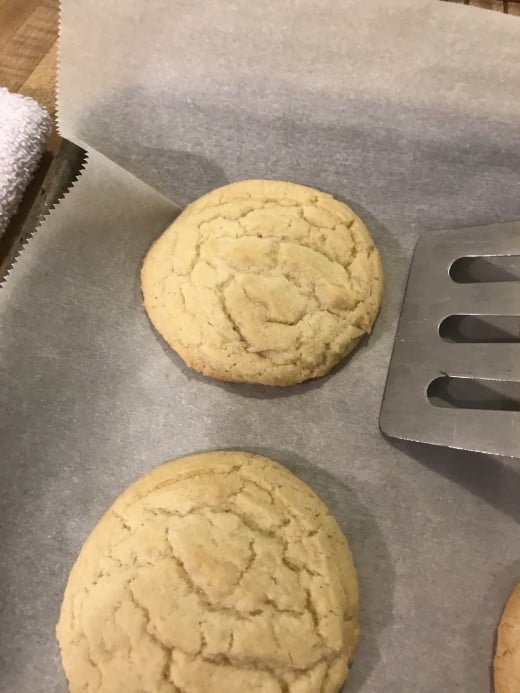 Letting the cookies rest for just a little on the baking sheet before moving them to a wire rack ensures they'll 'set', and not tear apart when you lift the hot cookies to a baking rack to cool completely. 