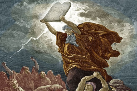 Moses at the base of Mt Sinai with the 10 commandments
