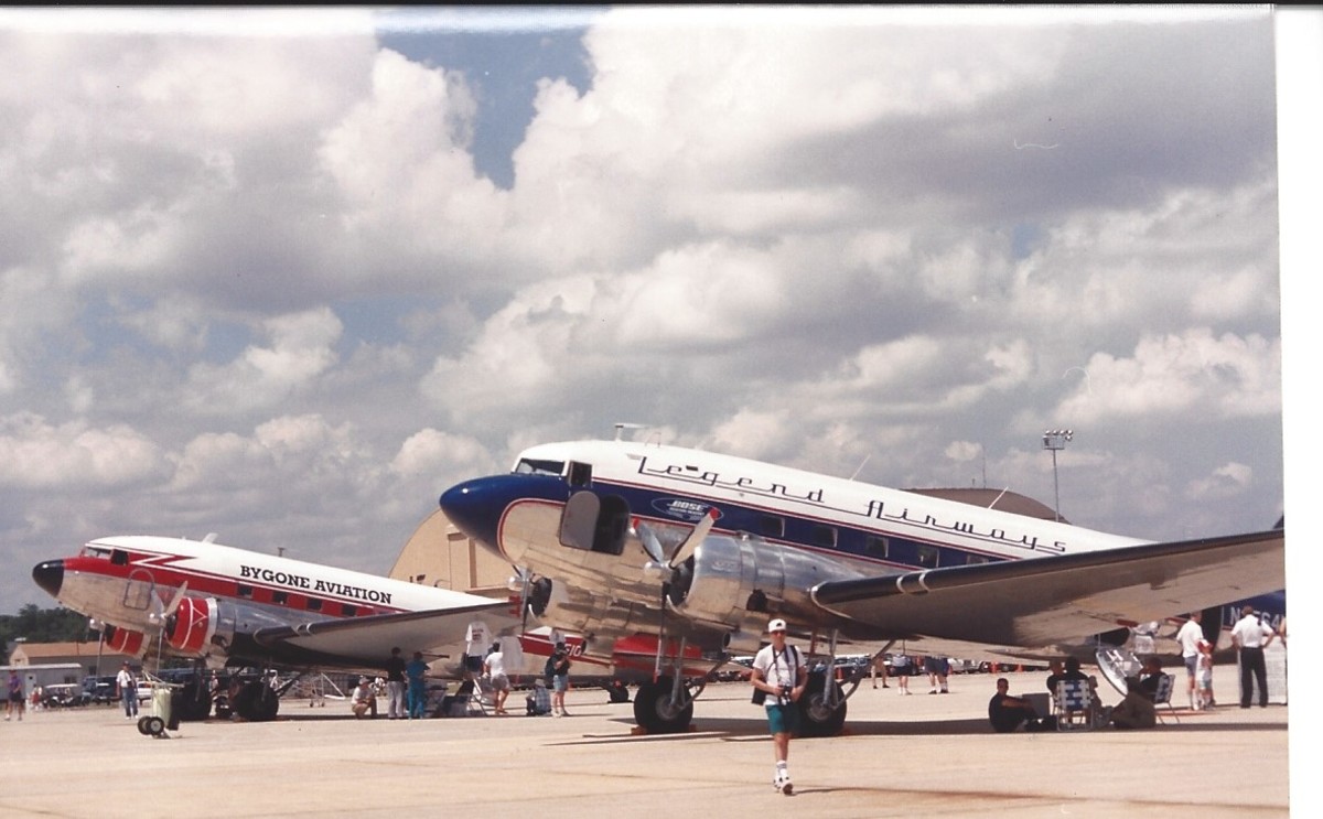 Two DC-3s at an Andrews AFB, MD, as part of Freedom Flight America, August 1995.  The airline named indicate their nostalgic purpose. 
