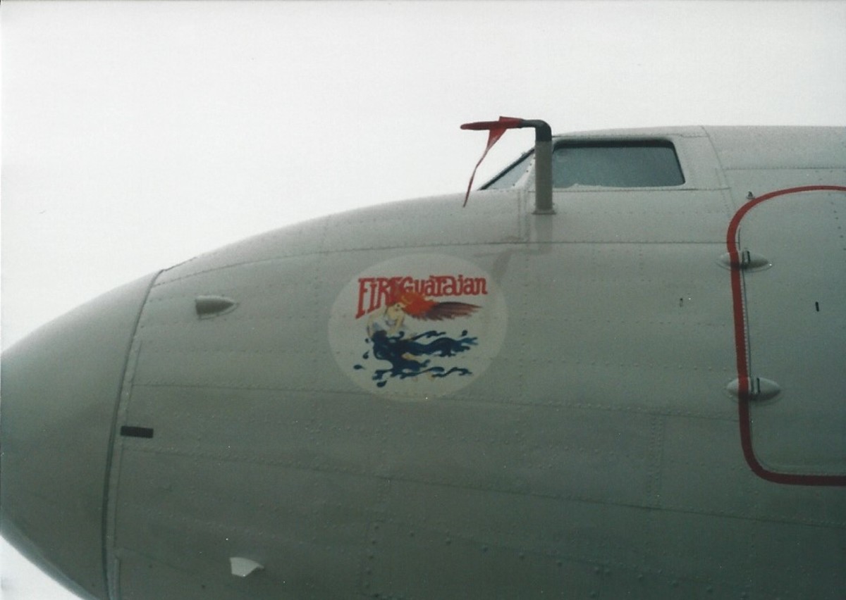 Nose art on a BT-67.  The nose art shows the aircraft's purpose.  Andrews AFB, MD, May 2000.