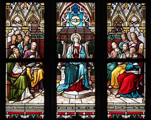 The Virgin Mary presented in stained glass.