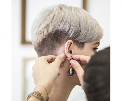 How To Choose Earrings For Sensitive Pierced Ears Tatring A Woman Tries On New Earring Piercings Should Not Cause Pain Or Irritation