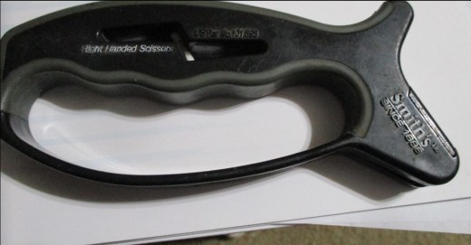 Comfort grip cutouts for fingers, and finger guard